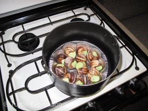 Fresh escargot simmering on the stove.