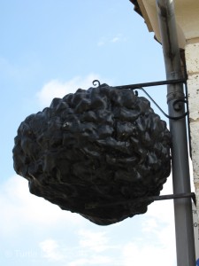 A giant truffle shingle advertises the museum.