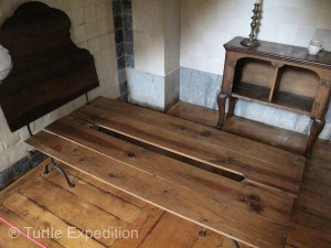 The monks living in the monastery lived a Spartan life. Their bed had a groove in the center to accommodate the spine. No mattress.