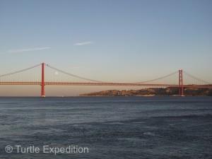 The 25th of April Bridge across the River Tejo was built in 1966 by the American Bridge Company who constructed the San Francisco-Oakland Bay Bridge, not the Golden Gate Bridge but it might explain its similarity in design.