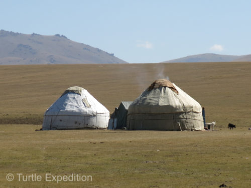 Whiffs of smoke drifting out of the yurt on the right, told us someone was already preparing dinner.