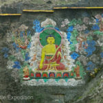 Images of Buddhas had been painted on rock faces. Lots of prayer flags told us we were getting close to the 3,643 m pass, (11,952 ft).