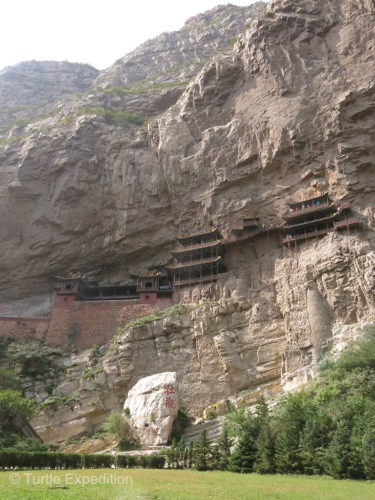 With all the flat land in China, one must wonder why someone would build a temple on the sheer side of a mountain.