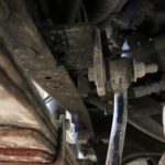The driver’s side frame anti-sway bar bracket was missing all of its Grade-8 bolts.