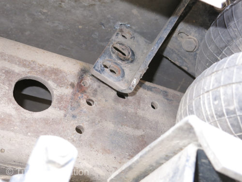 The bolts on the Hellwig air bag bracket on the passenger side were completely gone. Perhaps sheared off by the many potholes and drop-offs. The heavy duty bracket was bent beyond use. It was now pushing on the bottom of the camper box.