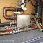 Our Eberspaecher D5 Hydronic, (far right), heats our water, pre-heats the engine and can also heat the camper, or all three at once, depending on how we set the valves to the transfer manifolds, (center).