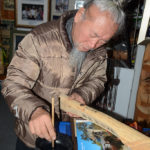 Mr. Kim Jong-heung is personalizing our carving with a special message.